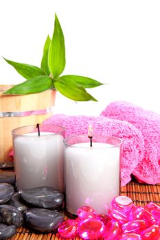 pink spa zen accessories and bamboo on cane mat