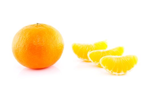 Whole and parts tangerine over white background