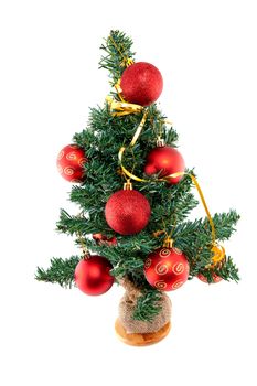 plastic christmas tree withred balls isolated on white background 

