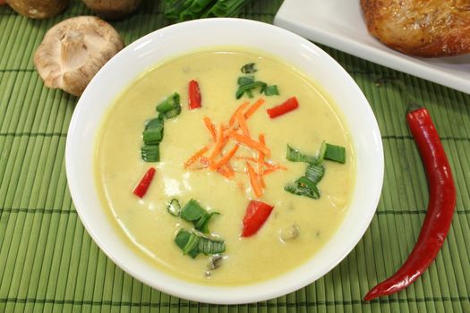 Curry soup with colorful vegetables and chicken