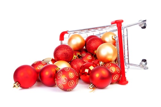 Falling Shopping cart with Christmas balls over white background