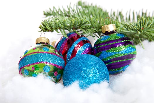 Colorful glitter Christmas balls over white background