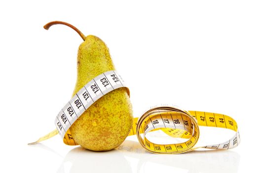 healthy diet; fresh pear with measure tape over white background