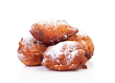pile of Dutch donut also known as oliebollen, traditional New Year's eve food isolated on white background