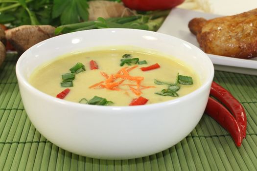Curry soup with colorful vegetables and chicken