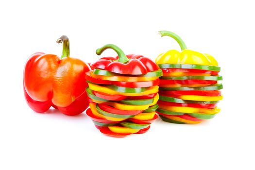 Paprika made out of colorful slices over white background