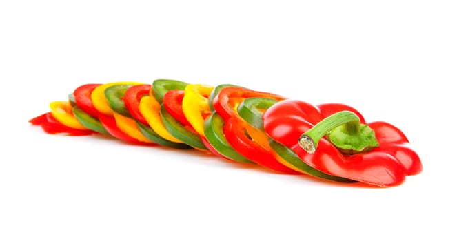 Paprika in mixed colorful slices over white background