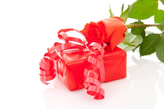 red present and rose for Valentines over white background