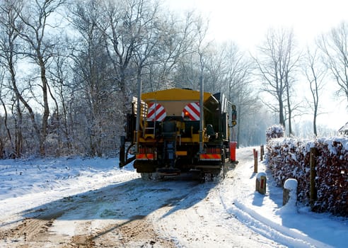 Dutch snow gritter sprinkle salt on the road