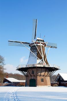 Dutch windmill near Apple in the snow
