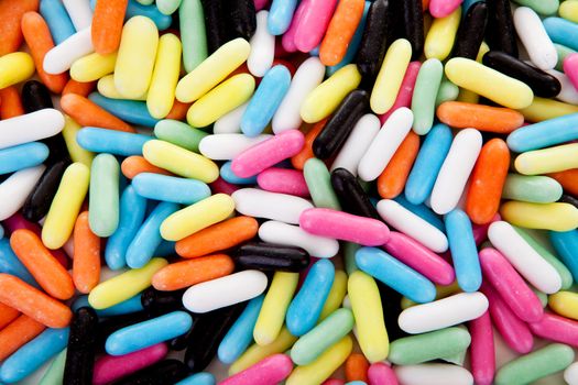 background of colorful laces rods candy in closeup 
