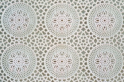 Lace is an openwork fabric, patterned with open holes in the work, made by machine or by hand.