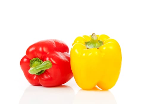 Two paprika vegetables isolated on white background
