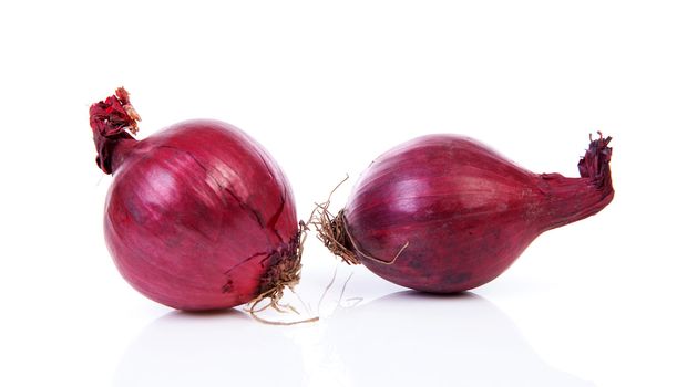 Two red onion isolated on white background