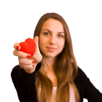 Teen girl with heart toy in hand, closeup