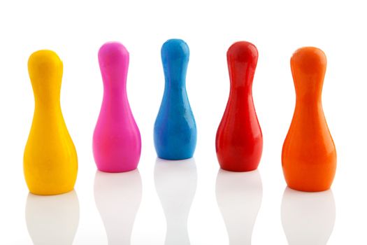 Five colorful bowling pins over white background