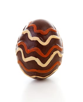 One big brown decorated easter egg over white background