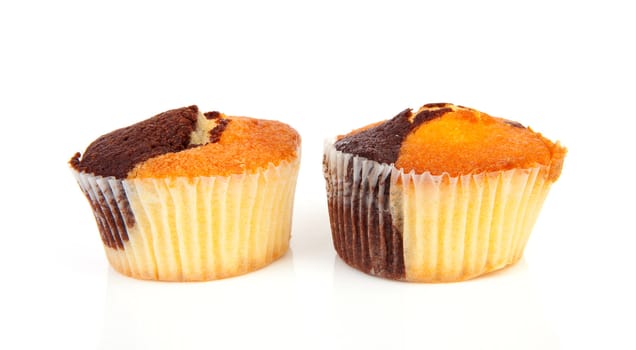 Two delicious cupcakes isolated on white background 

