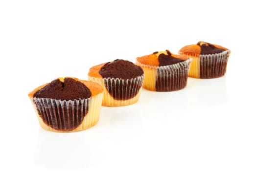 Four delicious cupcakes isolated on white background