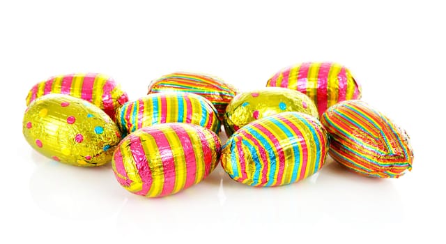 colorful chocolate easter eggs over white background 
