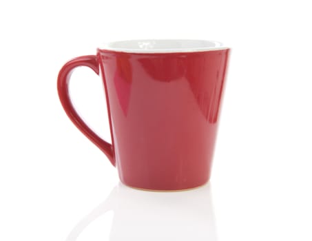 Red coffee cup over white background
