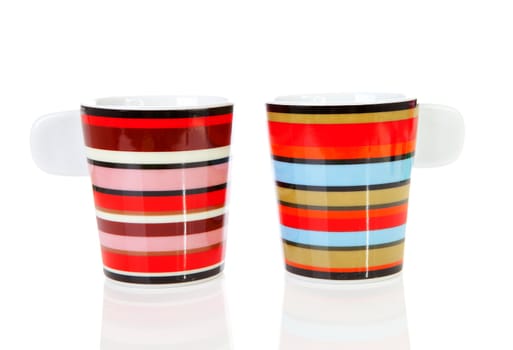 Two colorful empty coffee cups over white background