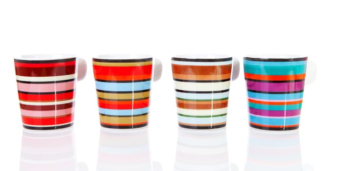 Four colorful empty coffee cups in a row over white background