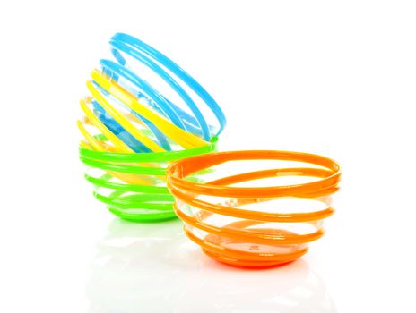 Colorful stacked funny bowl over white background