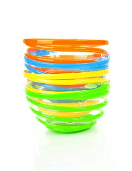 Colorful stacked funny bowl over white background
