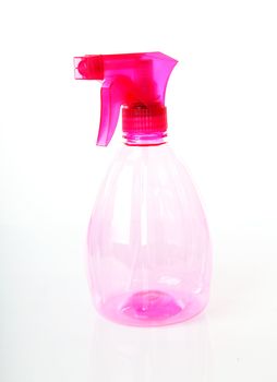 Pink plastic water plant sprayer over white background