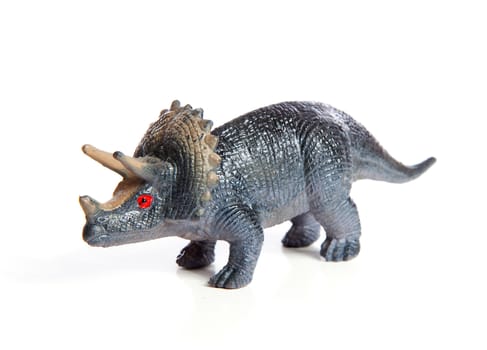 plastic dinosaur toy isolated on white background