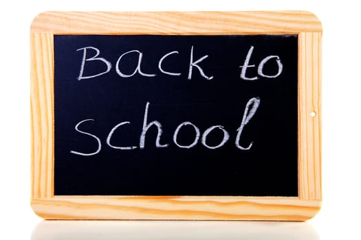 back to school written on blackboard slate over white background