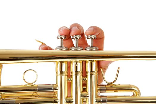 Close-up view of man's fingers as he plays trumpet over white background