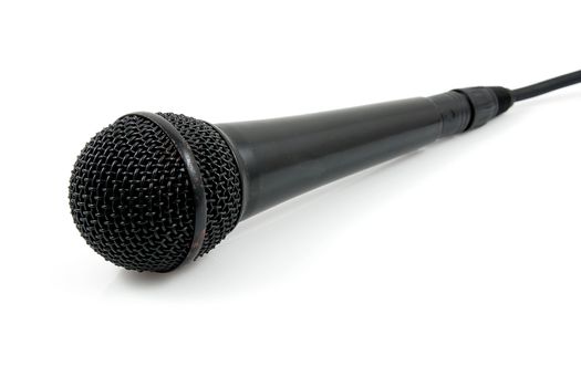 Old black  microphone with cable over white background