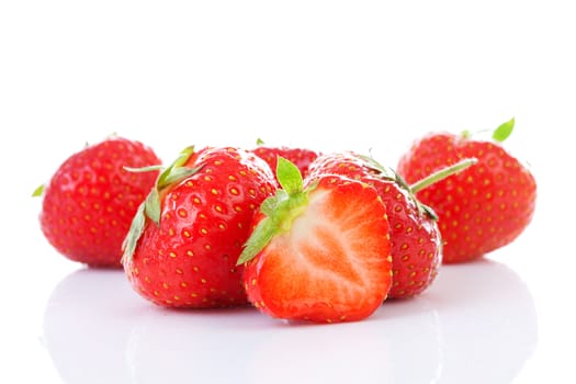 Couple of fresh strawberries in closeup over white background