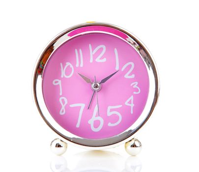 Silver with pink alarm clock over white background