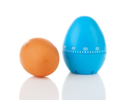 Chicken egg with blue timer over white background