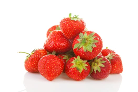 Pile of fresh strawberries in closeup over white background