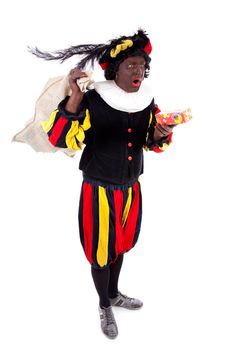 Zwarte piet ( black pete) typical Dutch character part of a traditional event celebrating the birthday of Sinterklaas in december over white background with present