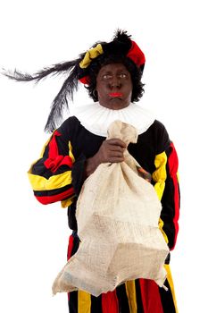 Zwarte piet ( black pete) typical Dutch character part of a traditional event celebrating the birthday of Sinterklaas in december over white background with heavy bag 