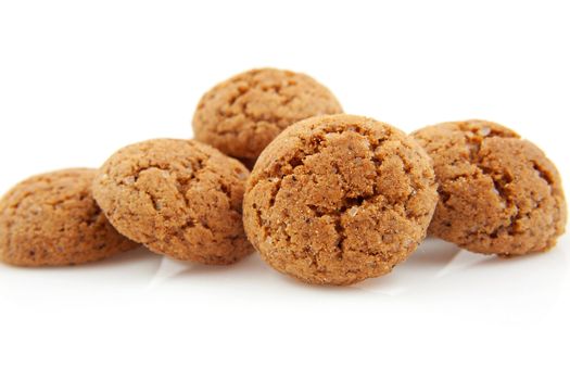 pile of pepernoten, typical Dutch cookies in december over white background