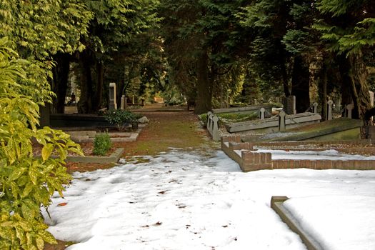 graveyard in the middle of the winter, covered with snow