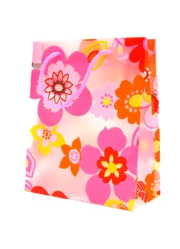 plastic shopping bag with floral motif over white background