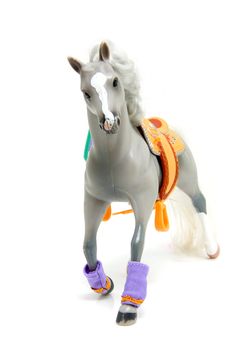 grey plastic toy horse over white background