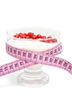 glass bowl with yogurt,berrie fruit and measure tape for dieting over white background