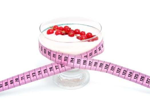 glass bowl with yogurt,berrie fruit and measure tape for dieting over white background