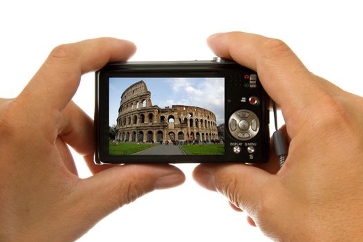Photo camera in hands taking picture of colosseum in Rome isolated on white background