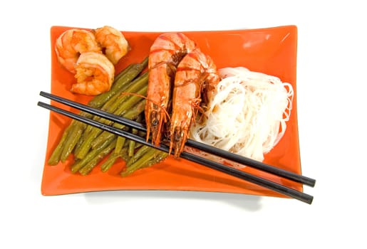 Oriental meal on orange plate isolated over white background