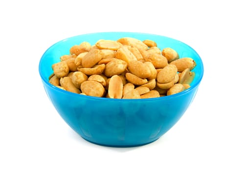 Blue bowl with salted peanuts over white background