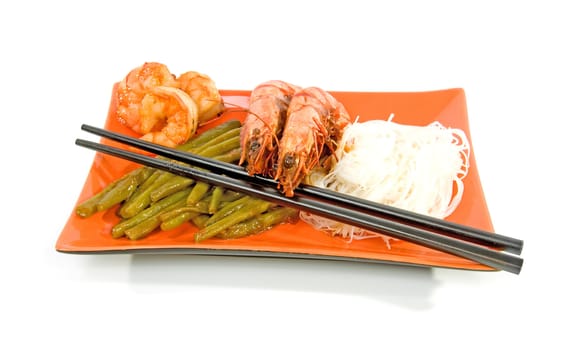 Oriental meal on orange plate isolated over white background